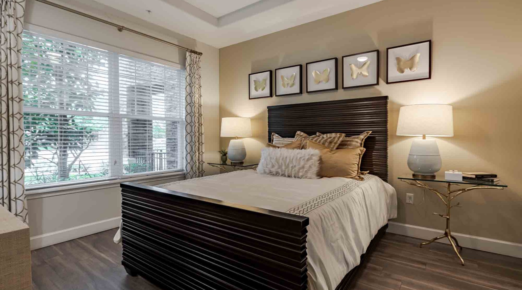 a bedroom with a bed and lamps