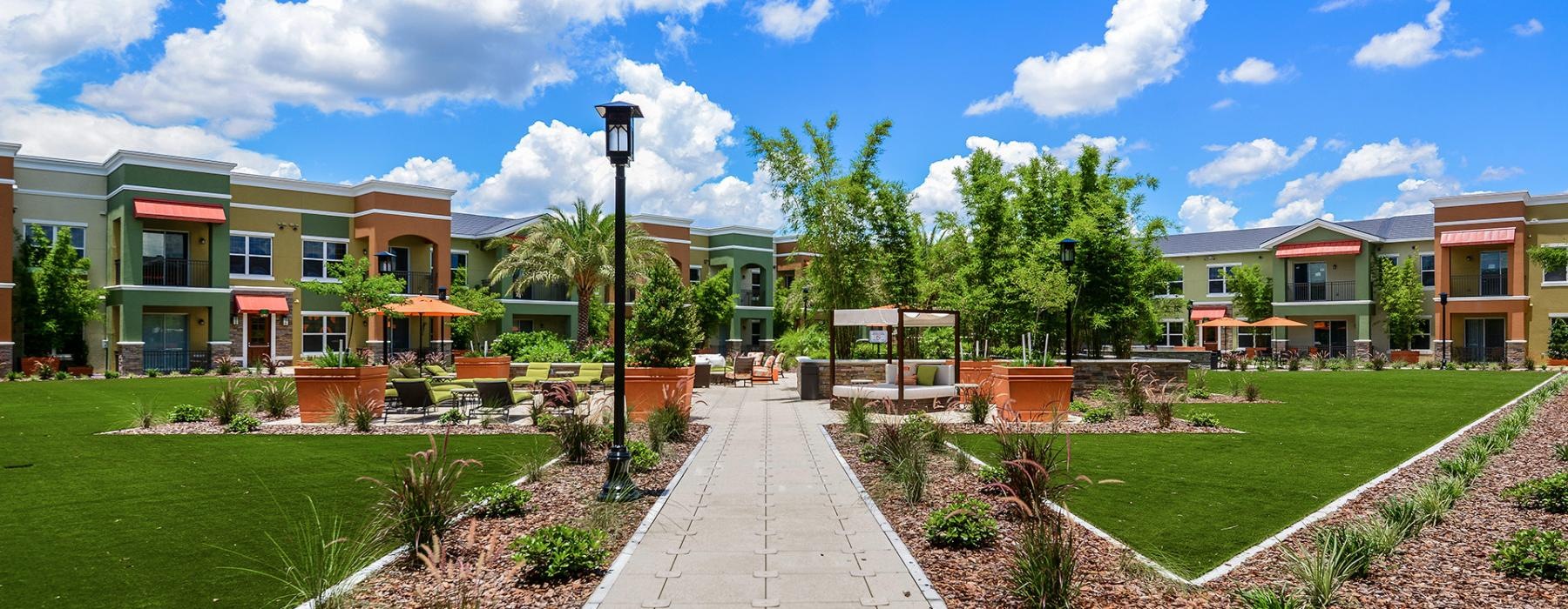 a path with buildings on the side