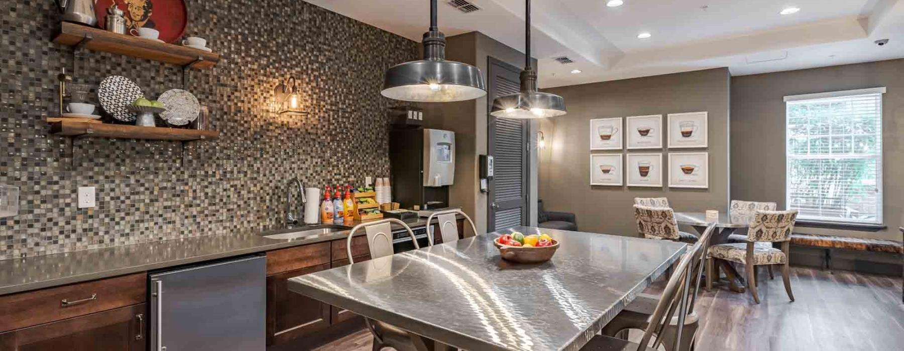 a kitchen with a table and chairs