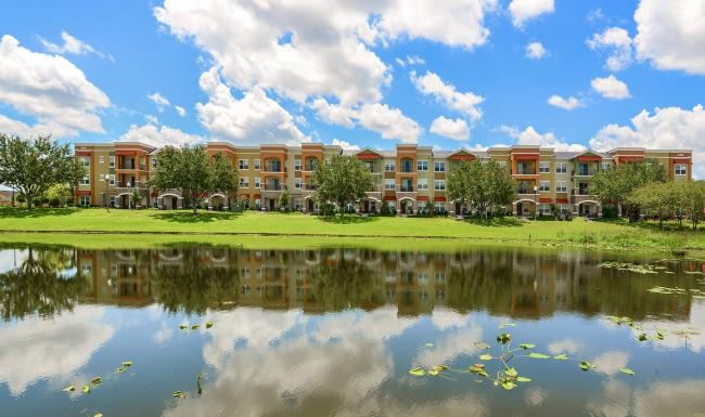 a building with a pond in front of it