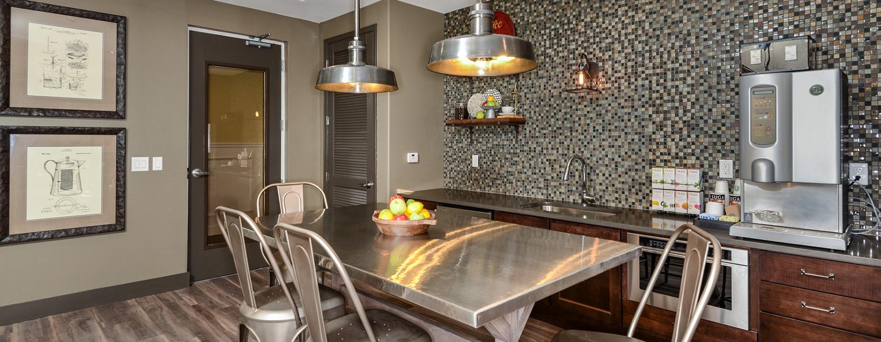 a kitchen with a table and chairs